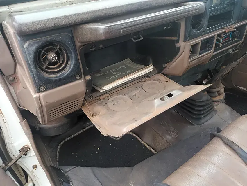 The Glove Box of a Toyota Land Cruiser is Open and Has a Book in It — South West 4WD Wreckers In Brisbane, QLD