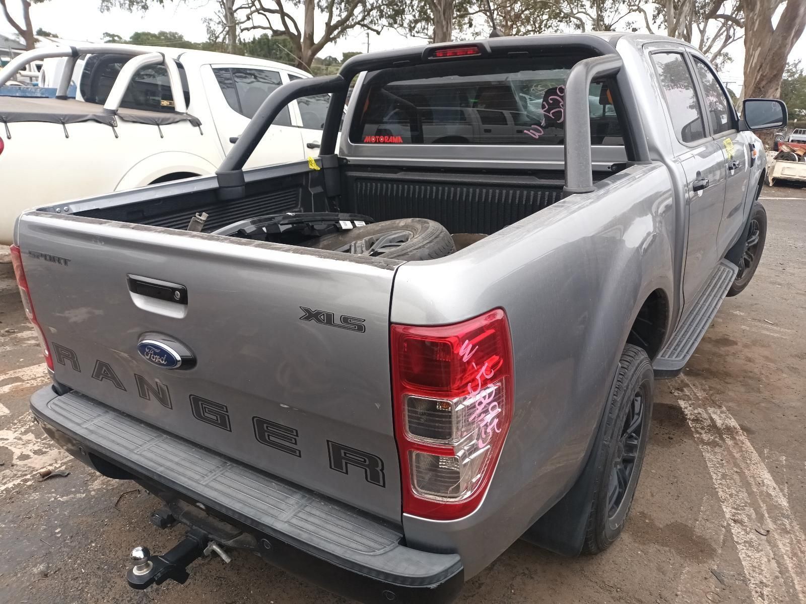 A Silver Ford Ranger Truck is Parked in a Parking Lot — South West 4WD Wreckers In Brisbane, QLD