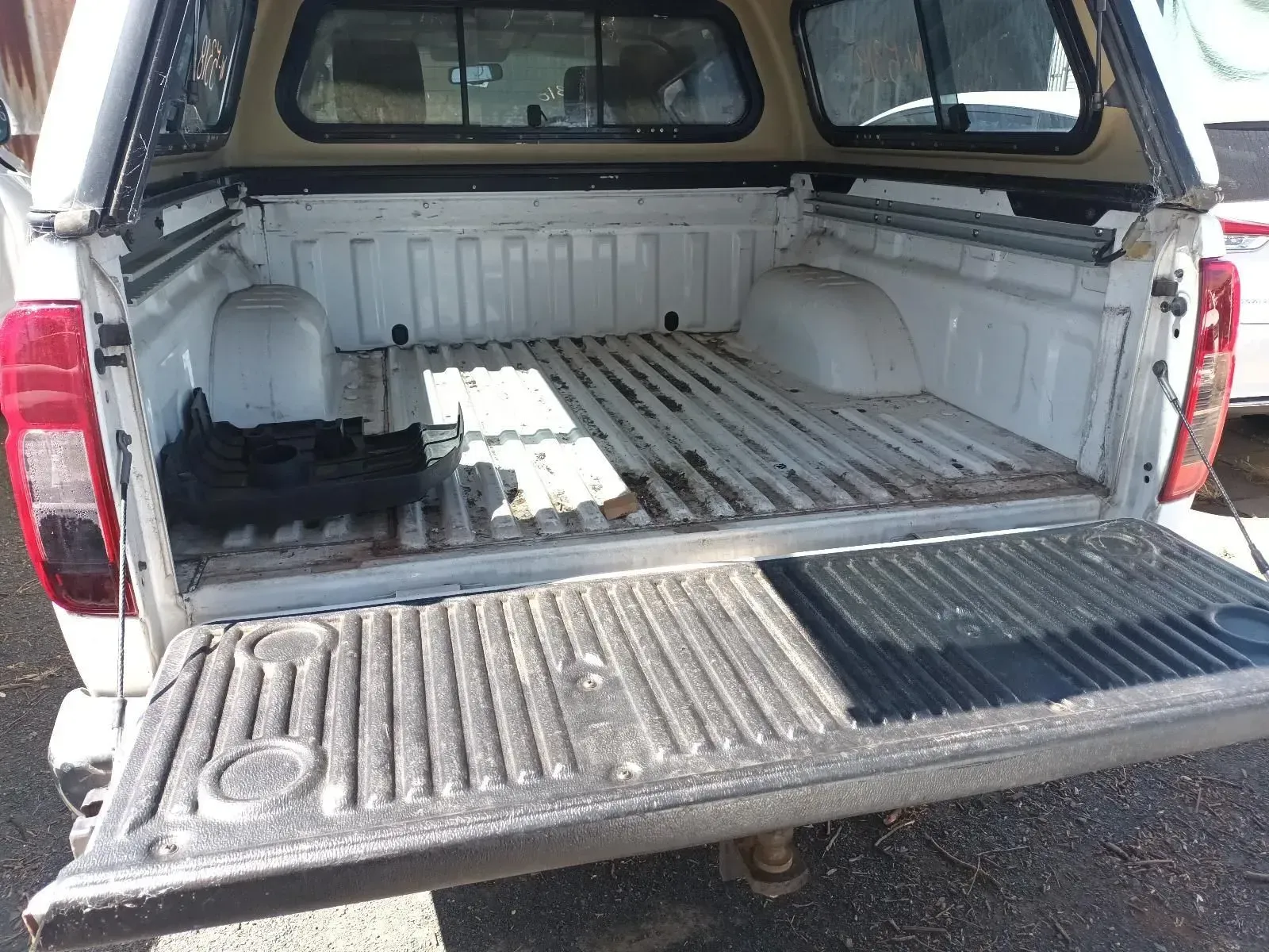 White Pickup Truck Bed With an Open Tailgate and a Canopy — South West 4WD Wreckers In Brisbane, QLD