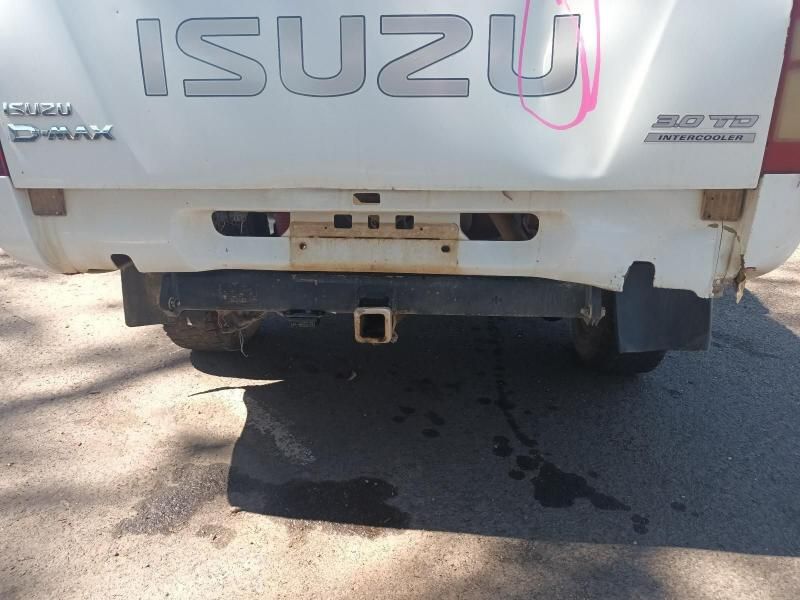 A White Isuzu Truck is Parked on the Side of the Road — South West 4WD Wreckers In Brisbane, QLD