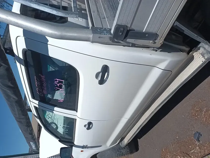 A White Truck is Parked on the Side of the Road — South West 4WD Wreckers In Brisbane, QLD