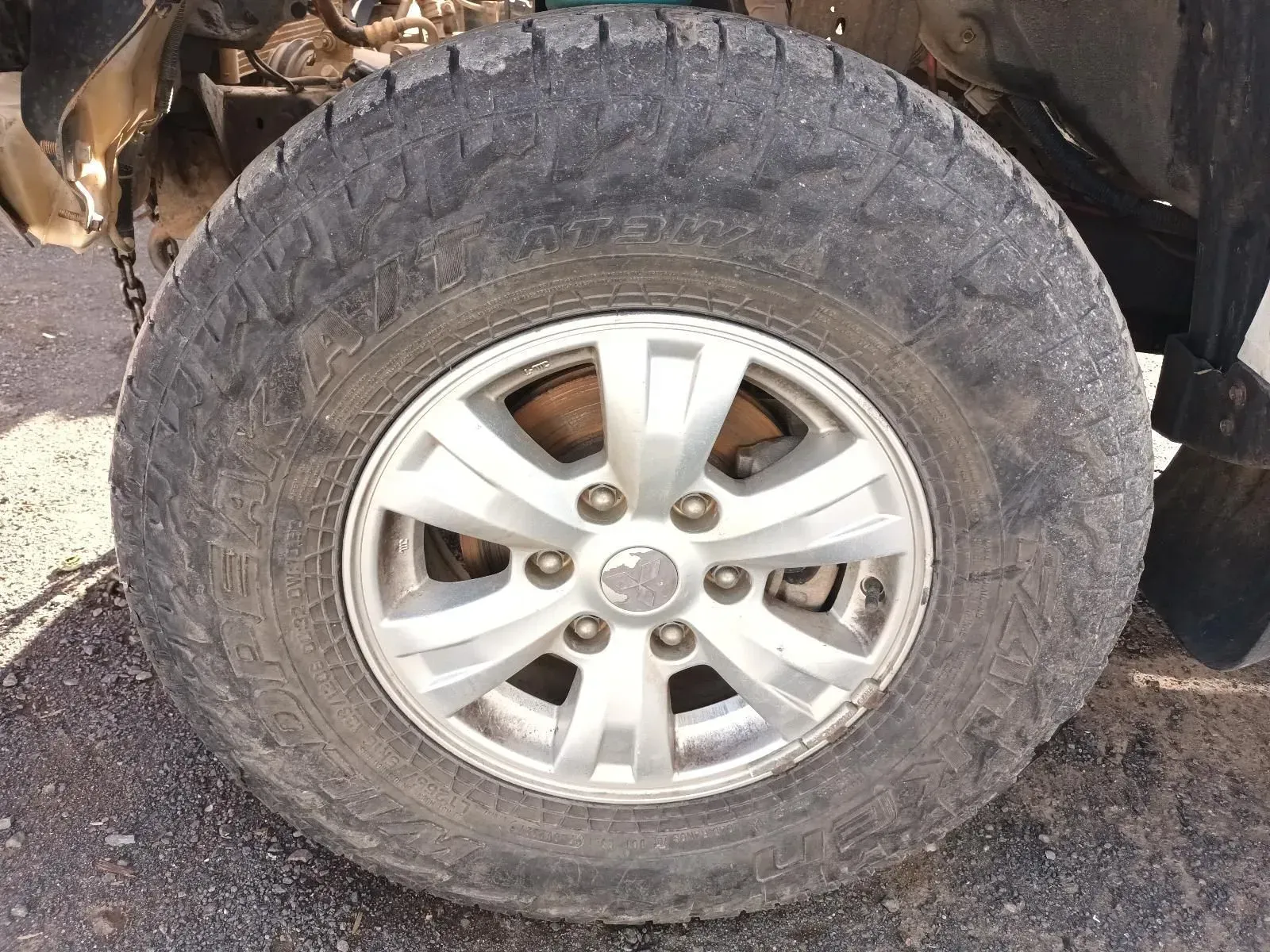 Close-up of a Worn Tyre on a Silver Rim. the Tyre is on a Vehicle, Likely Damaged — South West 4WD Wreckers In Brisbane, QLD