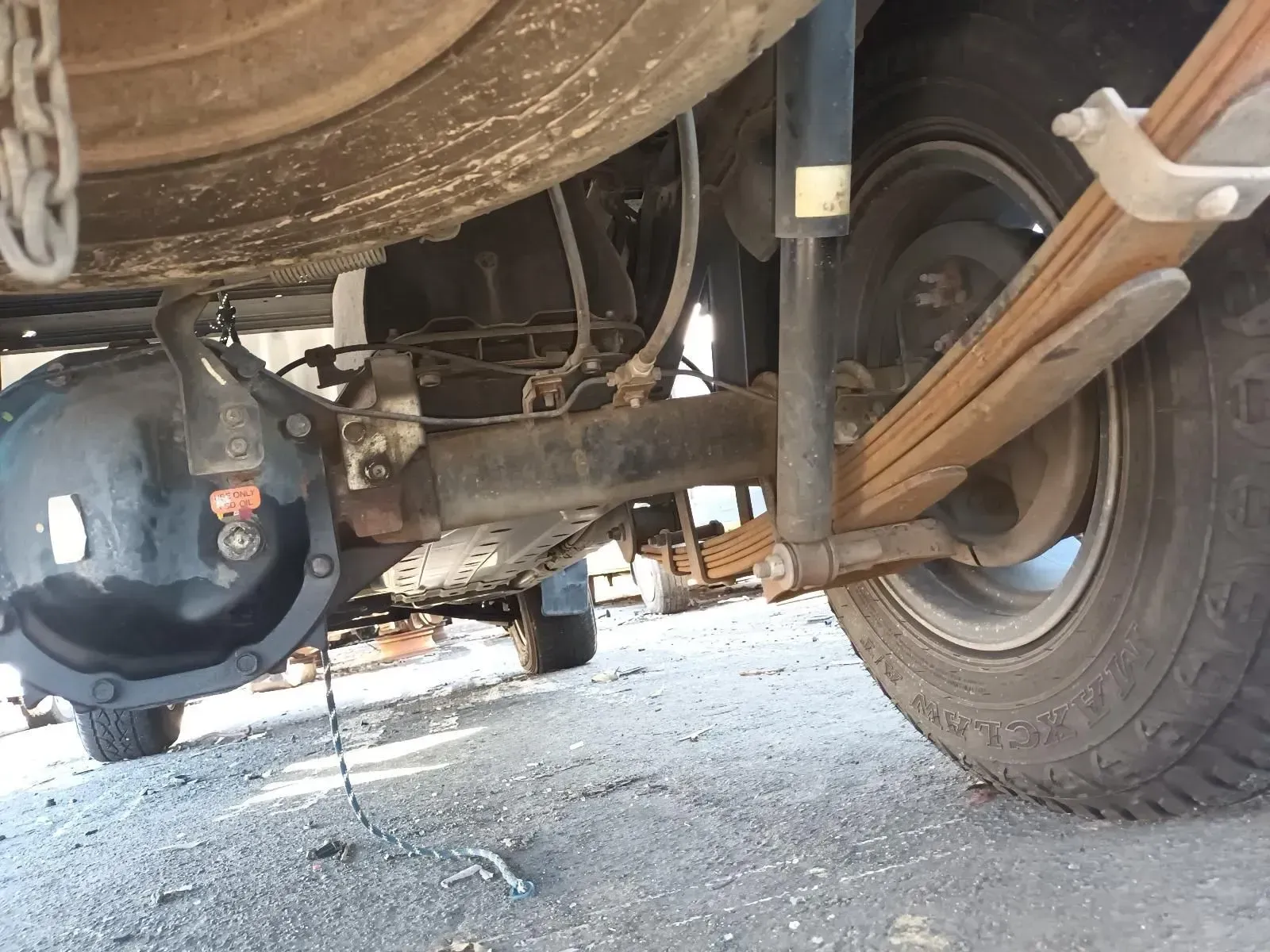 Underside View of a Vehicle Showing the Rear Axle, Suspension, and Tyre — South West 4WD Wreckers In Brisbane, QLD