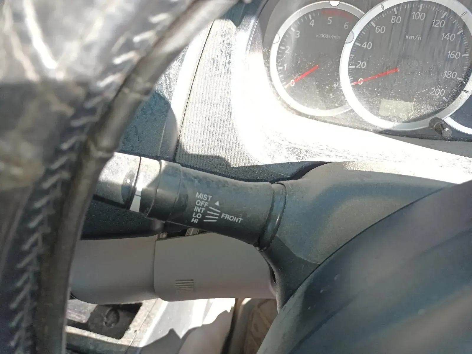 Steering Wheel With Turn Signal Stalk and Dashboard Gauges Visible — South West 4WD Wreckers In Brisbane, QLD