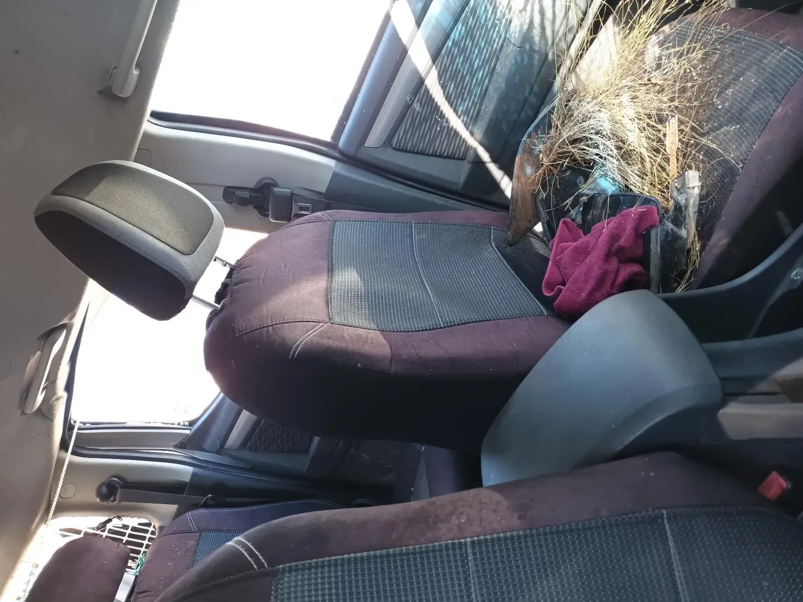 Car Interior With Front Seat, Headrest, and Debris. Dark Purple and Gray Seats — South West 4WD Wreckers In Brisbane, QLD