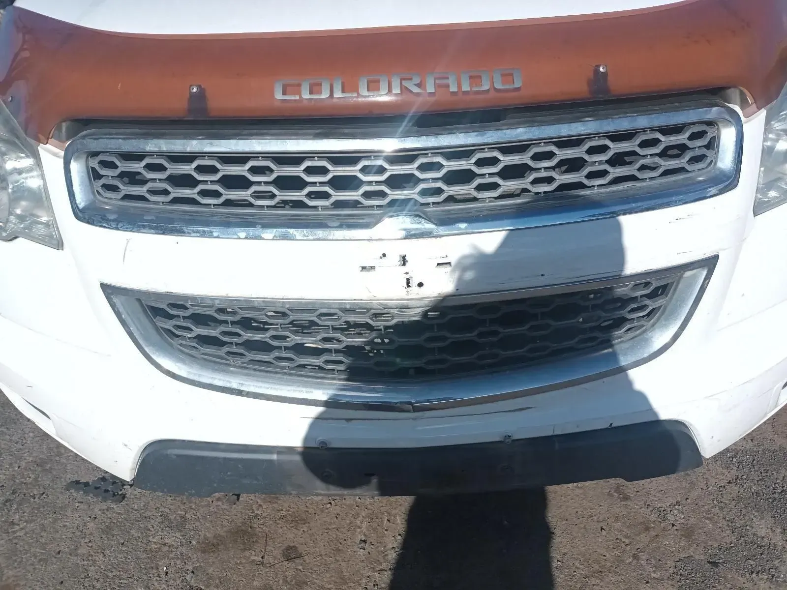 White Chevrolet Colorado Truck Grill, Orange Bug Deflector, and Shadow — South West 4WD Wreckers In Brisbane, QLD
