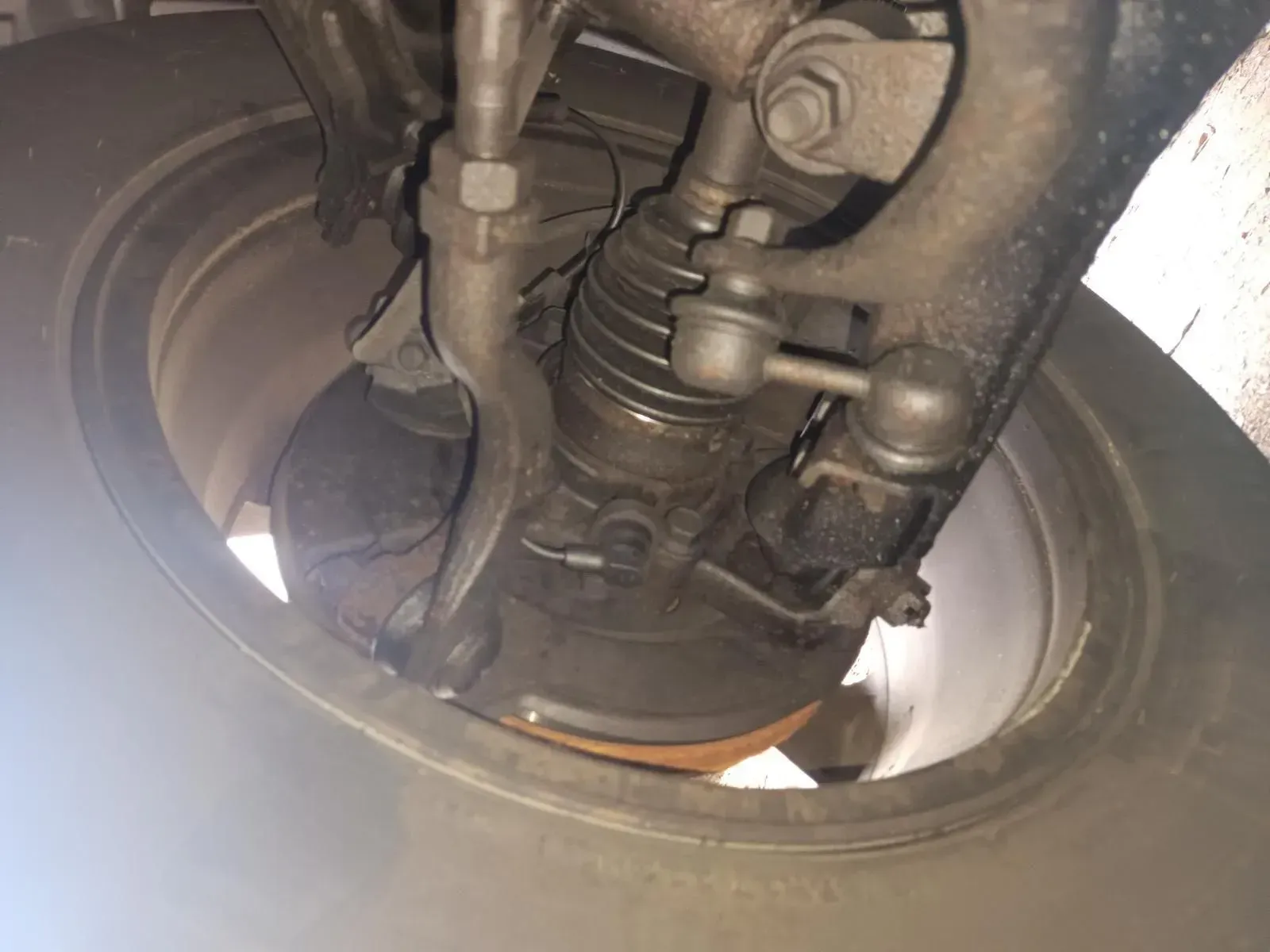 Car Front Suspension, Wheel and Tyre, Viewed From Below — South West 4WD Wreckers In Brisbane, QLD