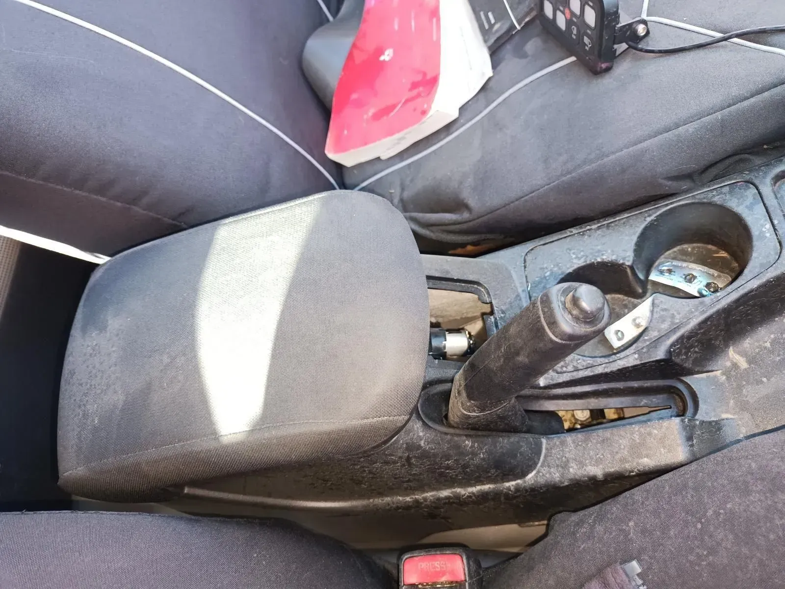 Car Interior With Center Console, Black Armrest, Cup Holders, and Handbrake — South West 4WD Wreckers In Brisbane, QLD