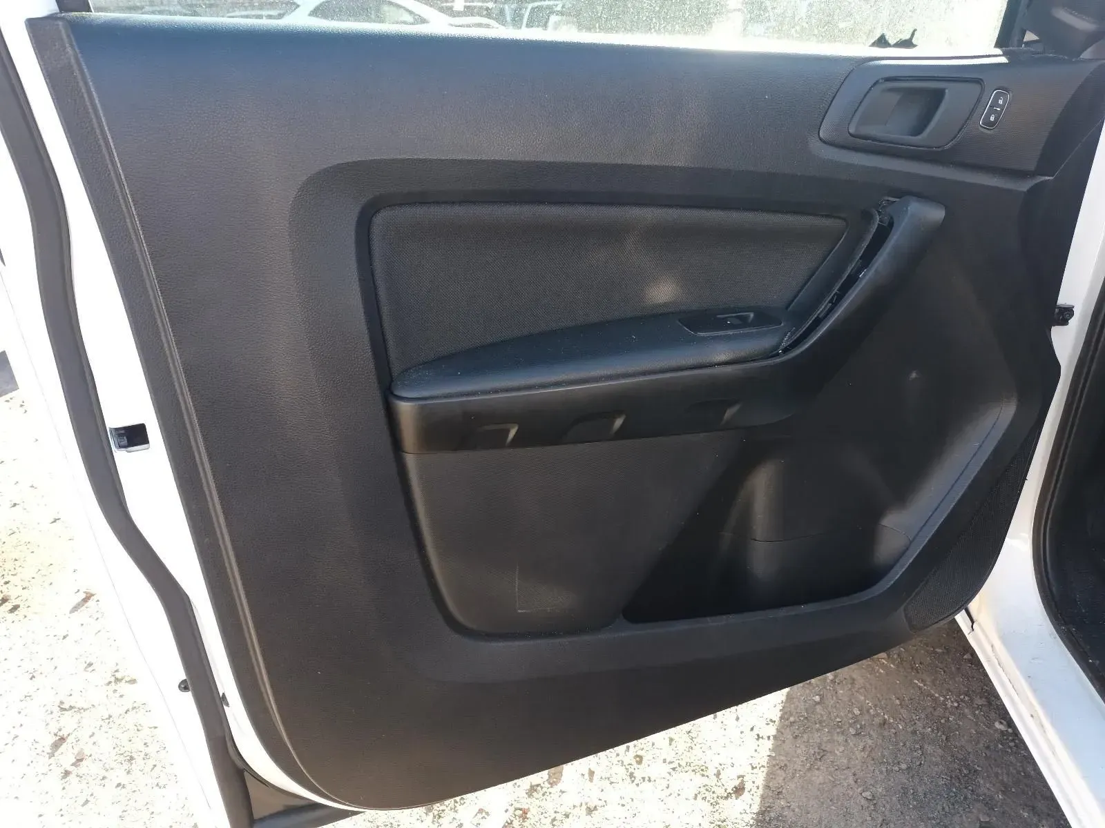 Black Car Door Panel With Handle, Control Buttons, and Storage Pocket — South West 4WD Wreckers In Brisbane, QLD