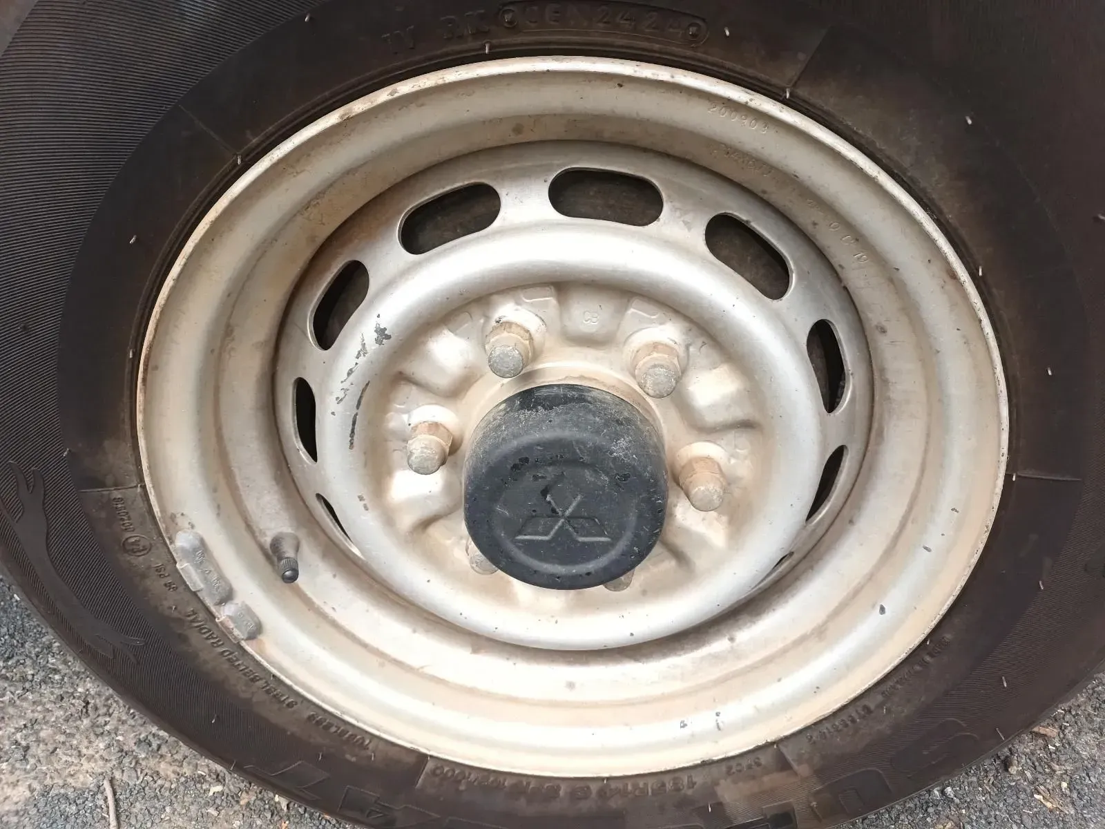 Silver Car Wheel With a Black Tyre and Center Cap — South West 4WD Wreckers In Brisbane, QLD