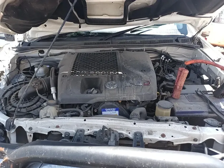 The Engine of a White Car With the Hood Up — South West 4WD Wreckers In Brisbane, QLD