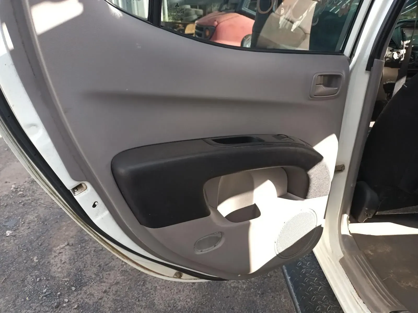 Gray and Black Car Door Panel With a Handle and Cup Holder — South West 4WD Wreckers In Brisbane, QLD