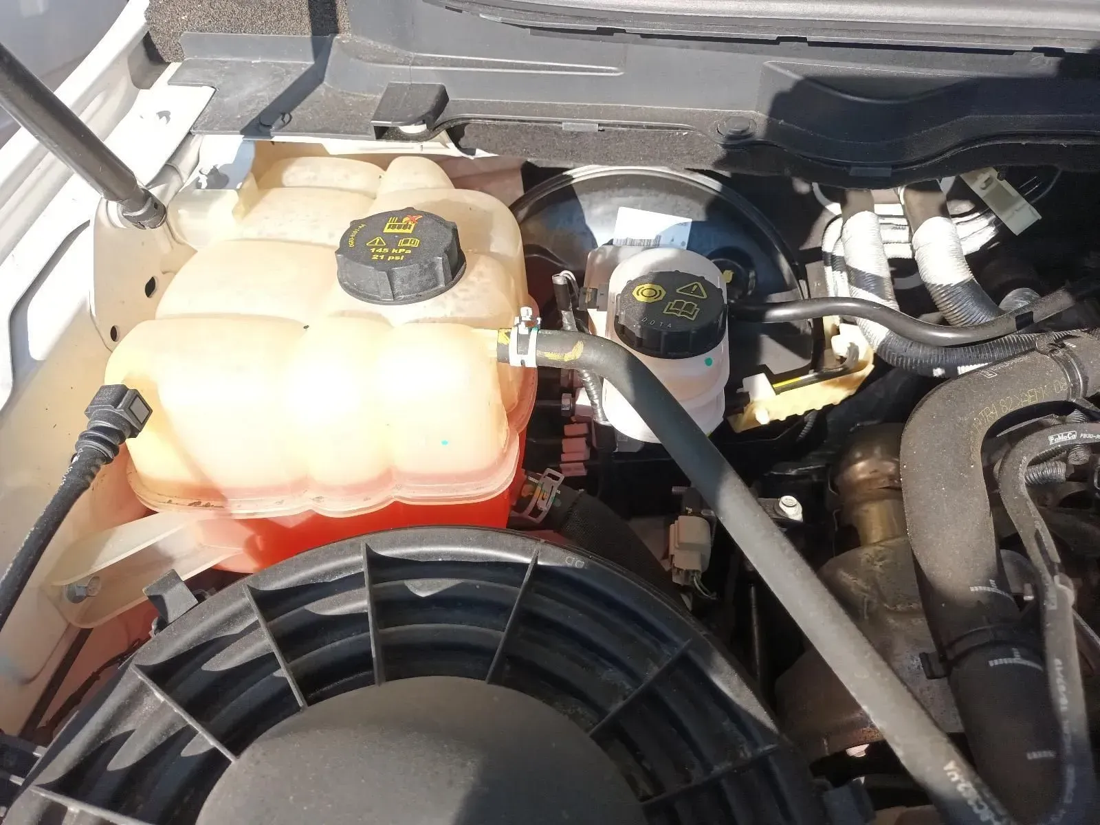 Engine Bay With Coolant Reservoir, Brake Fluid Reservoir, and Fan — South West 4WD Wreckers In Brisbane, QLD