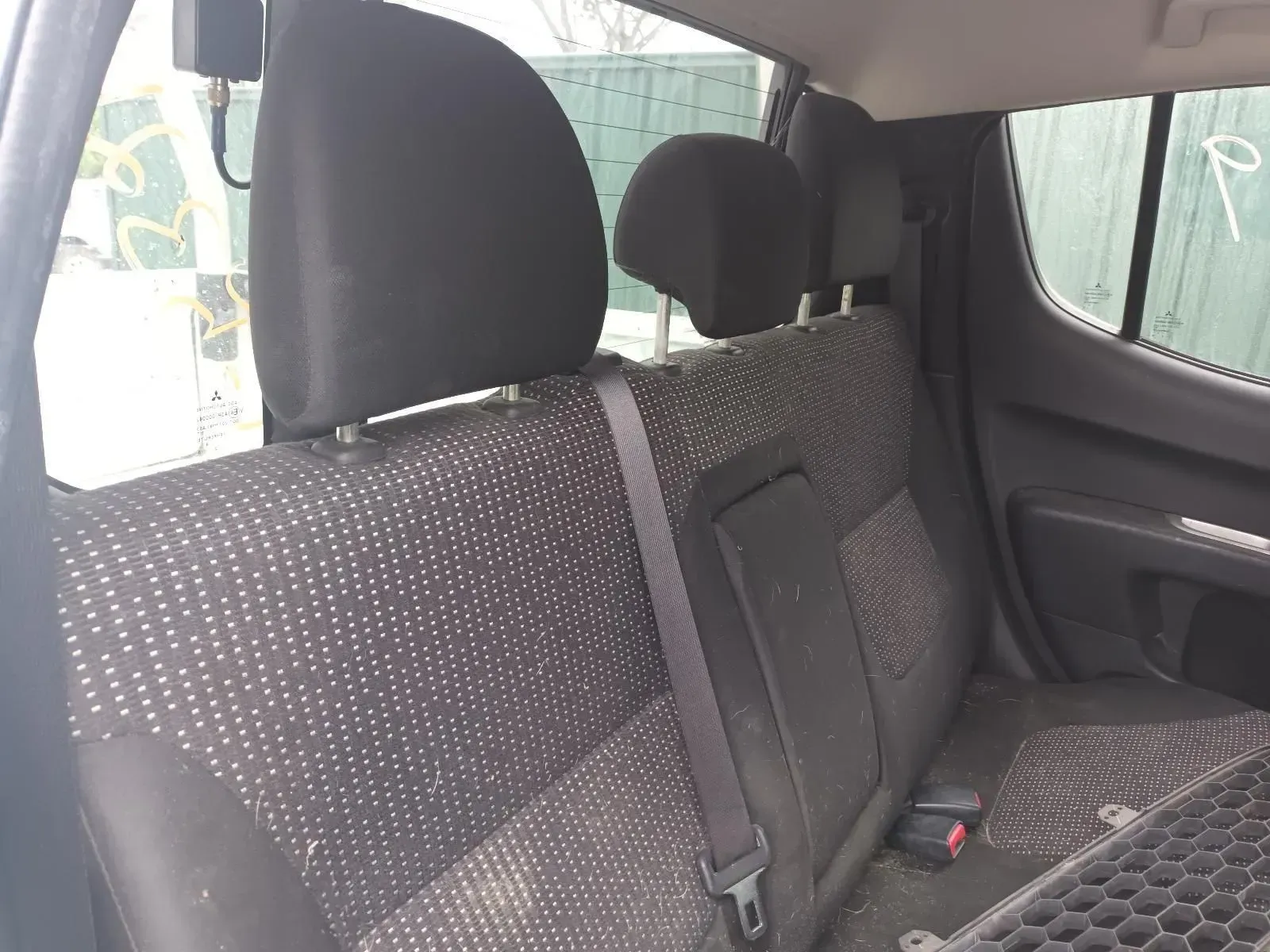 Backseat of a Truck With Black Fabric, Headrests, and a Seat Belt — South West 4WD Wreckers In Brisbane, QLD