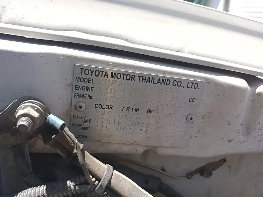 A White Toyota Motor Thailand Co. Ltd. Car With a Sticker on the Hood — South West 4WD Wreckers In Brisbane, QLD