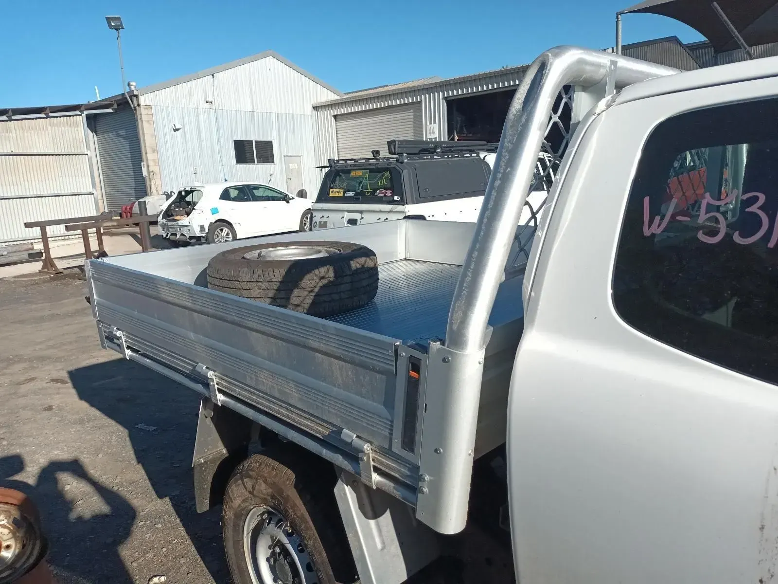 White Pickup Truck Bed With Roll Bar — South West 4WD Wreckers In Brisbane, QLD