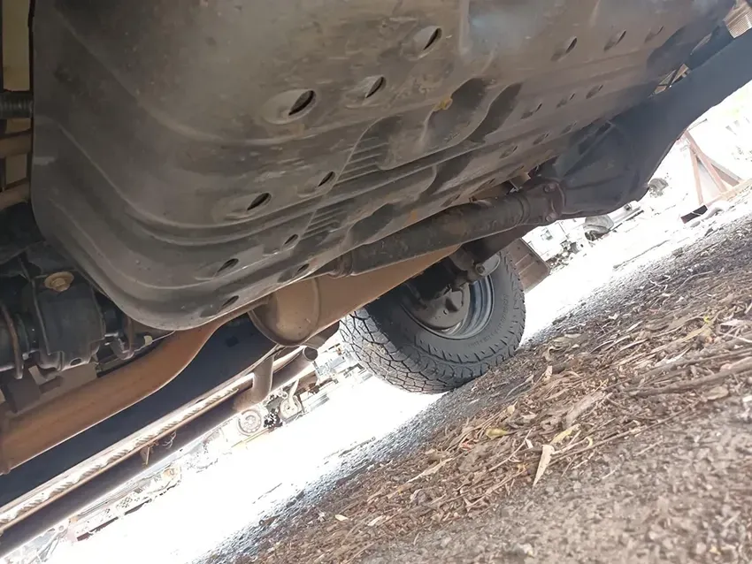 A Close Up of the Underside of a Car on a Dirt Road — South West 4WD Wreckers In Brisbane, QLD