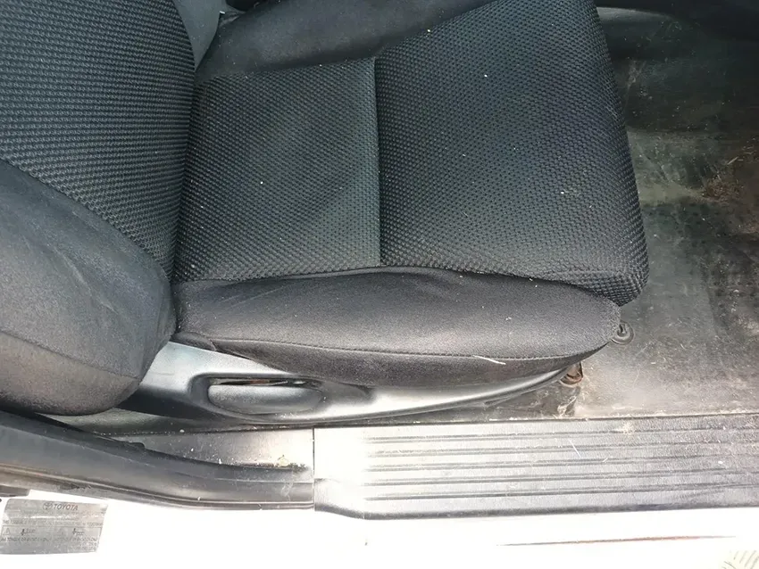 A Black Car Seat is Sitting in the Door of a Car — South West 4WD Wreckers In Brisbane, QLD