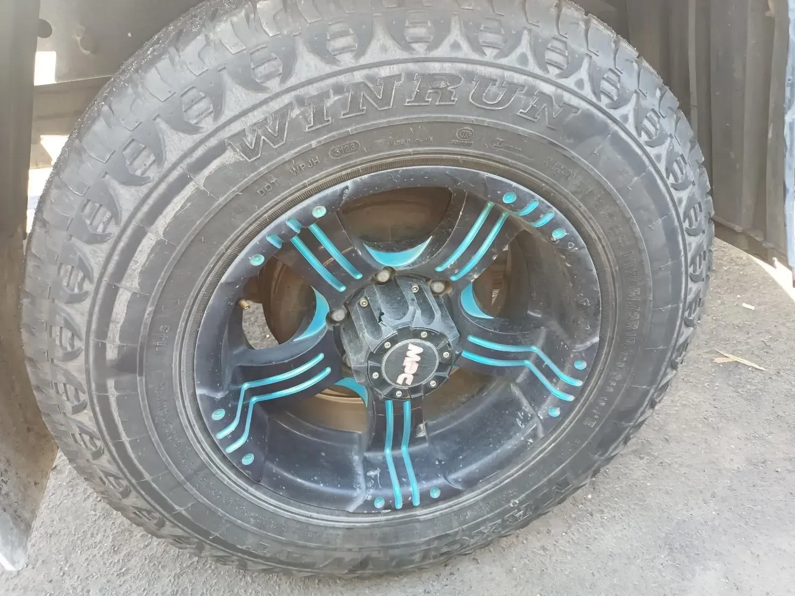 Black and Blue Wheel With a Winrun Tyre on a Vehicle — South West 4WD Wreckers In Brisbane, QLD
