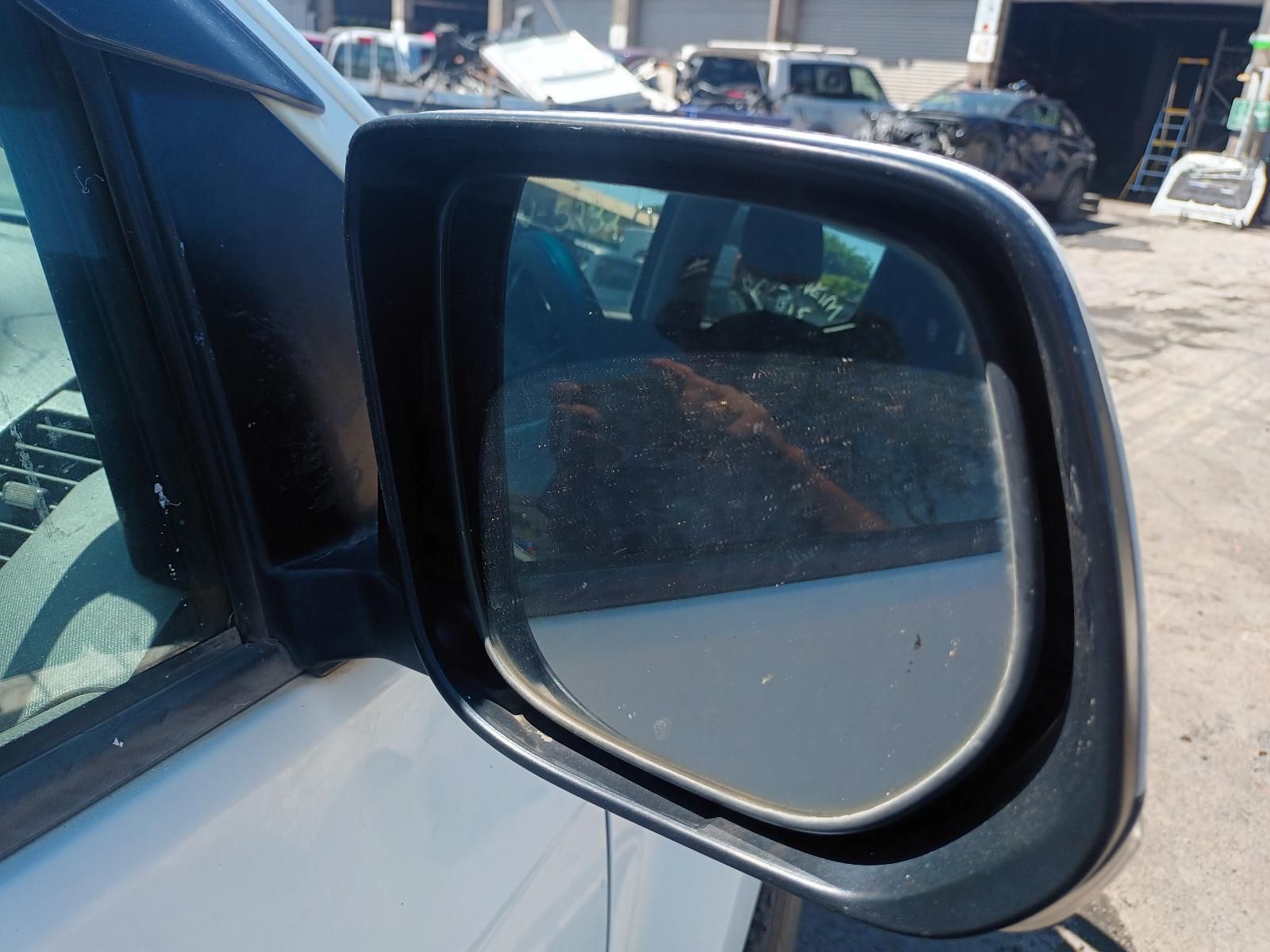 A Close Up of a Side View Mirror on a White Car — South West 4WD Wreckers In Brisbane, QLD