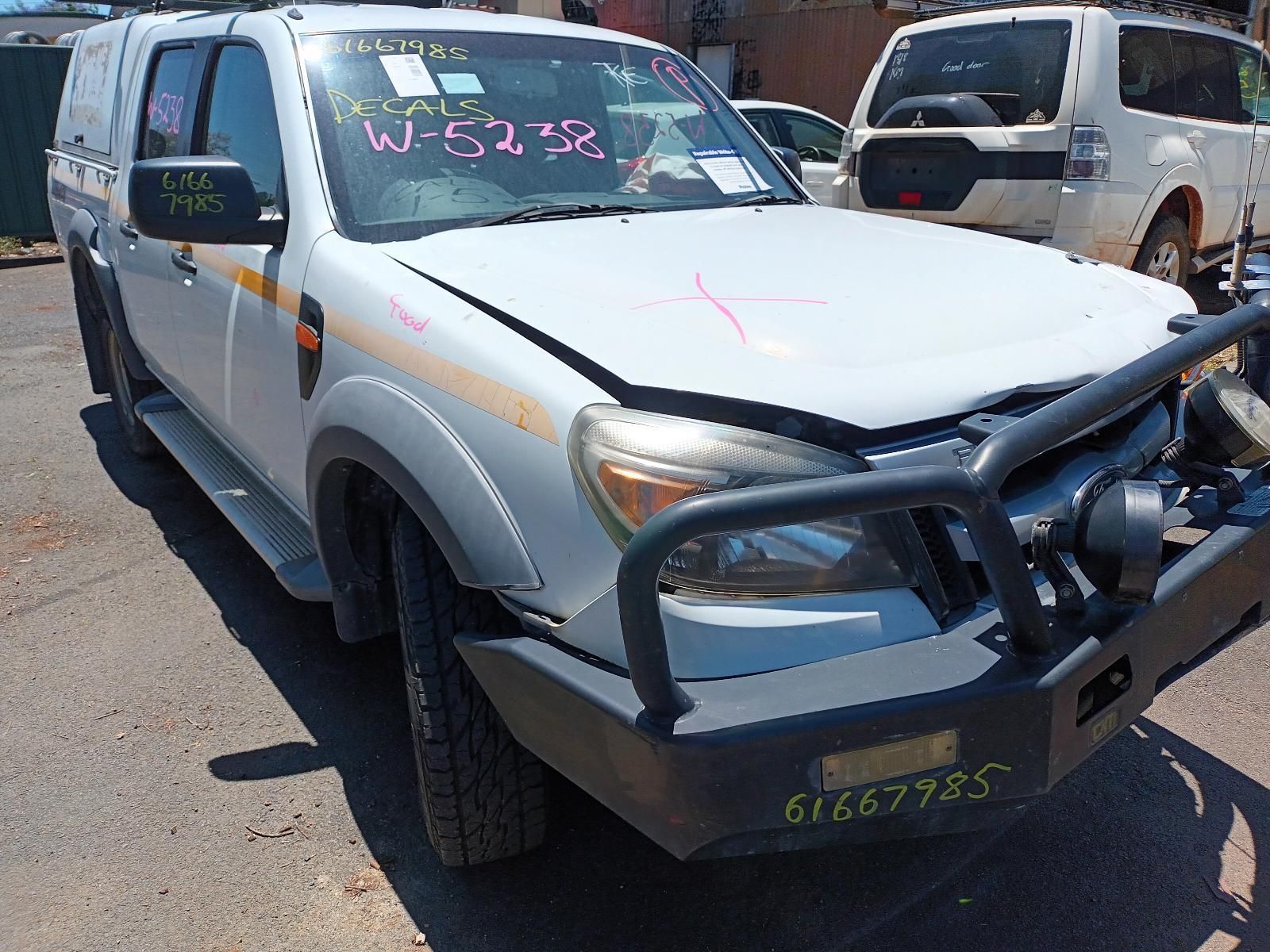 A White Truck with the Hood Up is Parked on the Side of the Road — South West 4WD Wreckers in Harristown, QLD