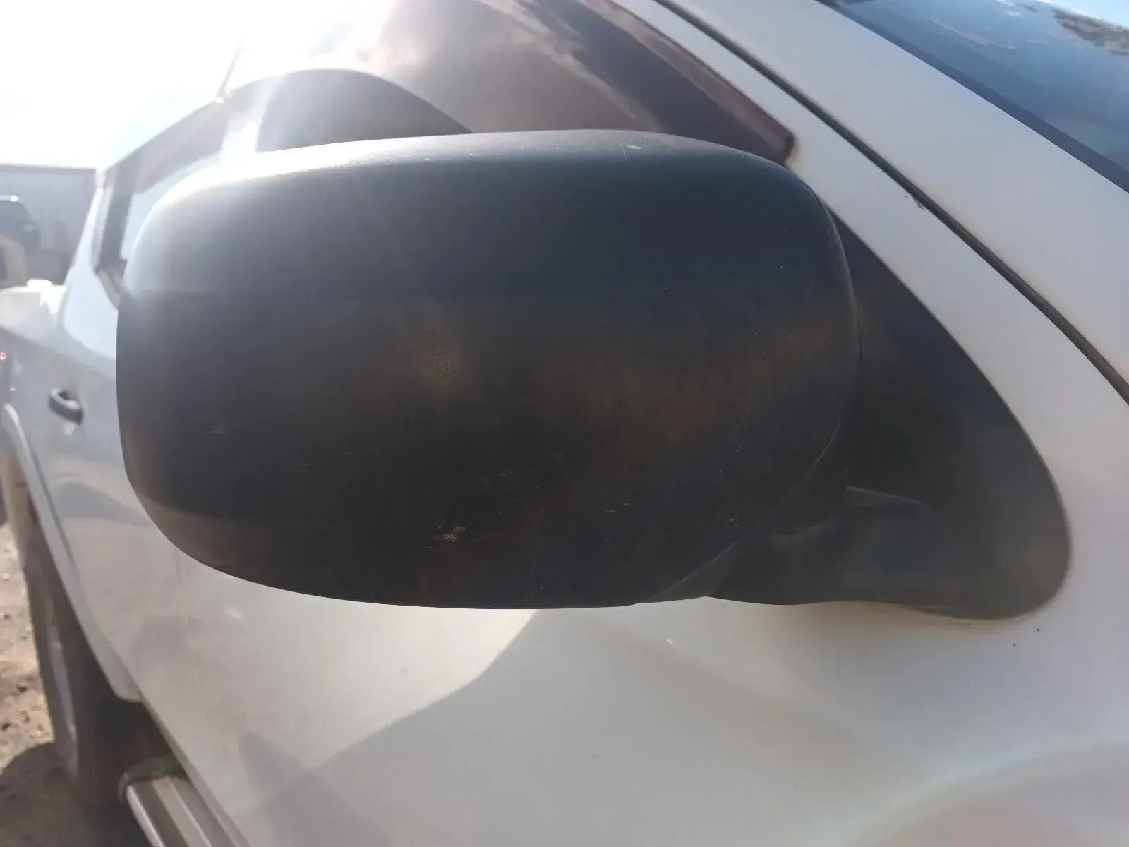 Black Side-view Mirror on a White Pickup Truck — South West 4WD Wreckers In Brisbane, QLD