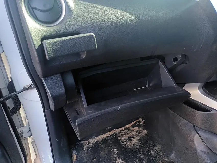 A Dirty Glove Box in a White Car — South West 4WD Wreckers In Brisbane, QLD