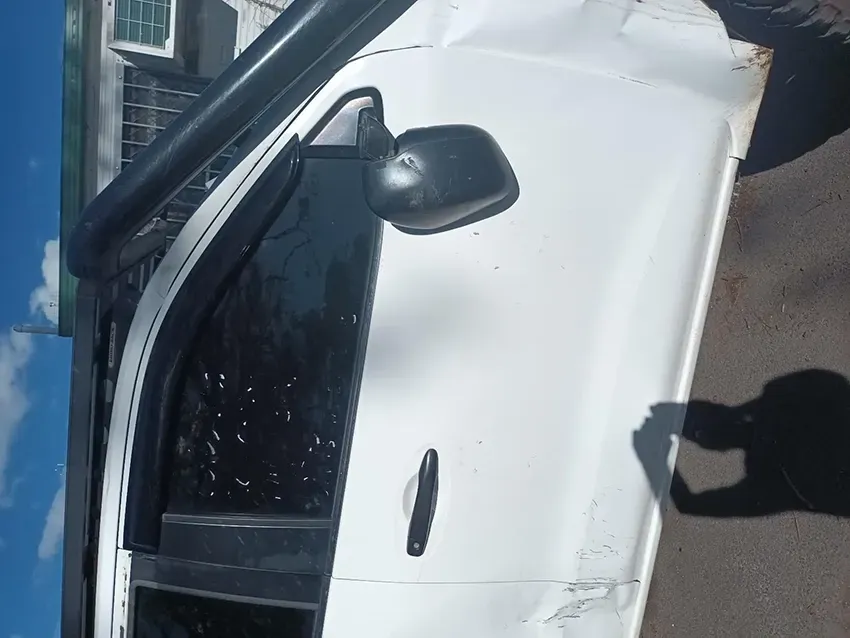 A White Van with a Shadow of a Person on the Door — South West 4WD Wreckers In Brisbane, QLD