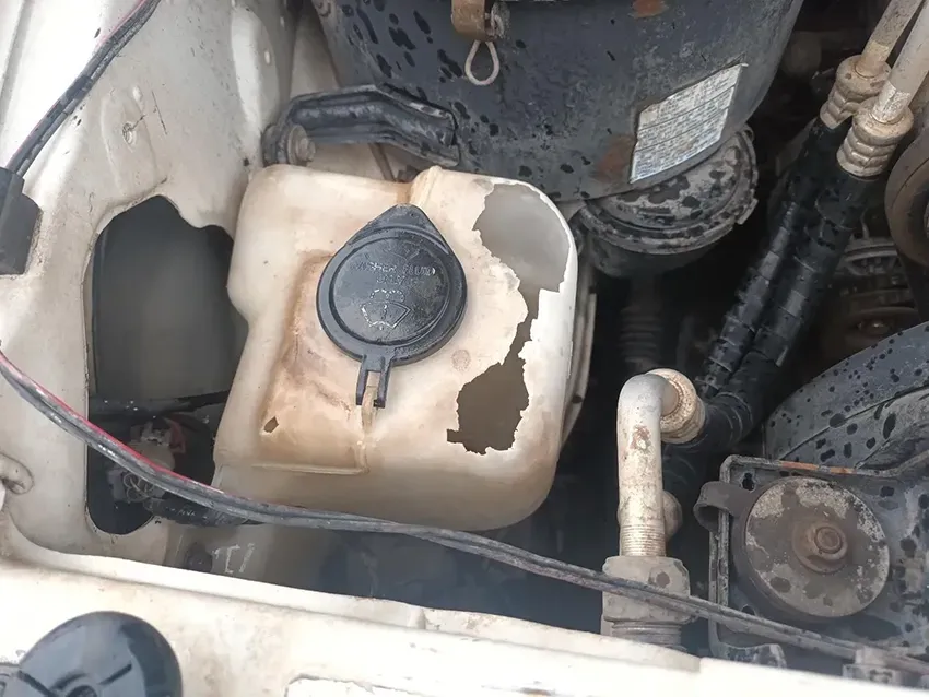 A Close Up of a Car Engine With a Broken Bottle — South West 4WD Wreckers In Brisbane, QLD