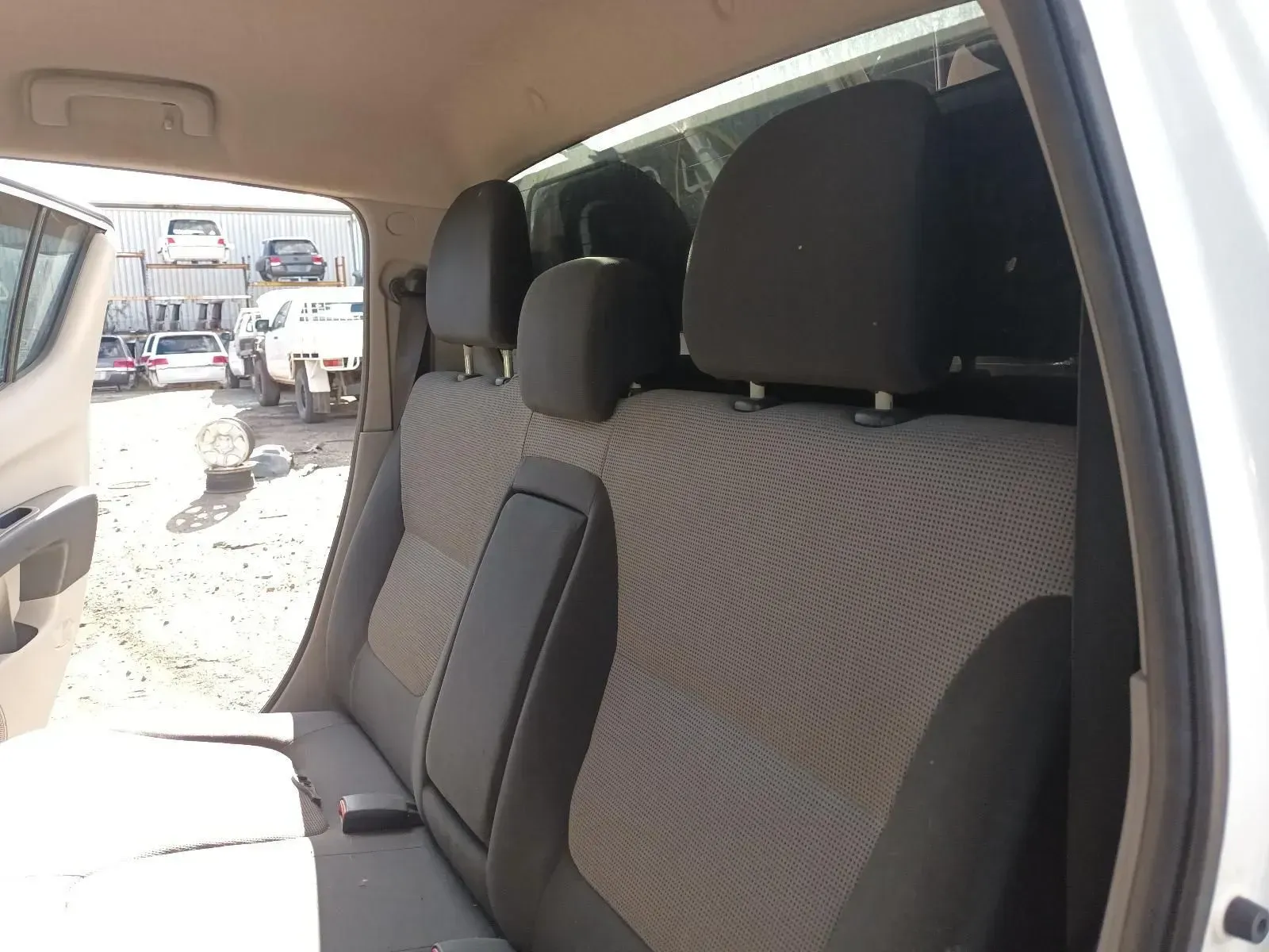 Back Seats of a White Pickup Truck With Three Headrests — South West 4WD Wreckers In Brisbane, QLD