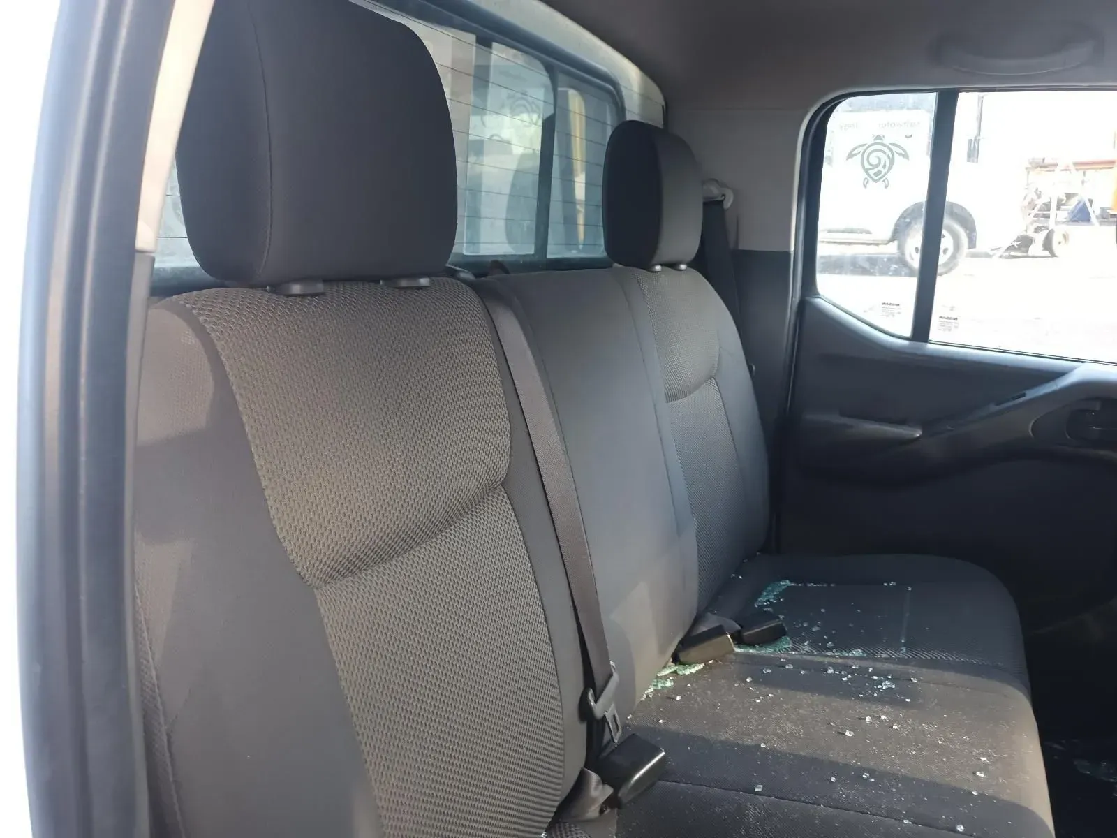 Back Seat of a White Pickup Truck With Broken Glass — South West 4WD Wreckers In Brisbane, QLD
