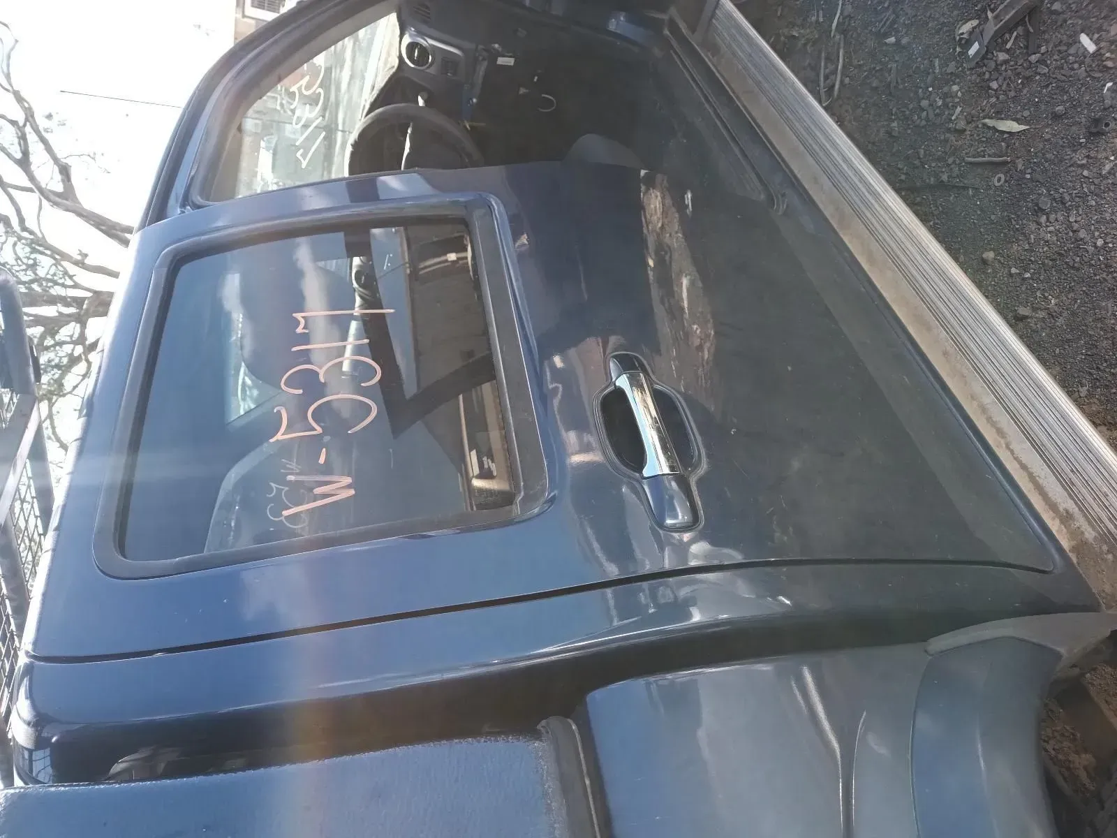 Blue Car Door With Window and Handle, Likely at a Junkyard — South West 4WD Wreckers In Brisbane, QLD