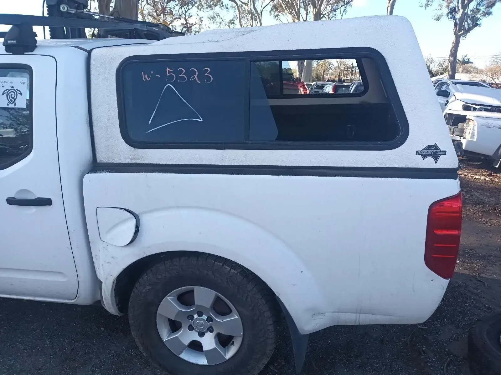 White Pickup Truck With a Camper Shell; Side View — South West 4WD Wreckers In Brisbane, QLD