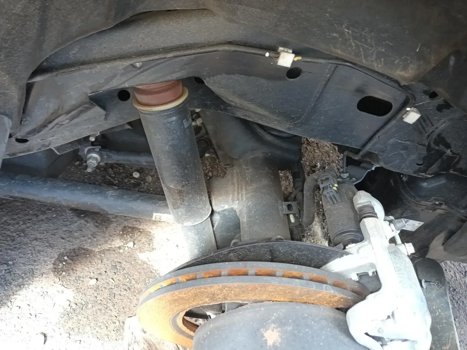 Rusty Brake Rotor and Suspension Components of a Vehicle, Likely Damaged — South West 4WD Wreckers In Brisbane, QLD