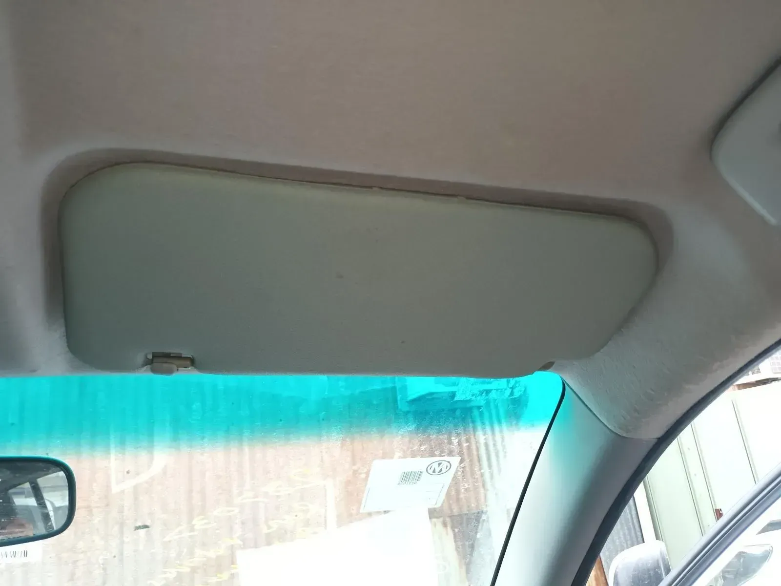 Tan Car Sun Visor, in Front of a Windshield With Some Light Blue Tint — South West 4WD Wreckers In Brisbane, QLD