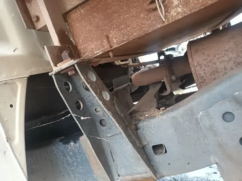 A Close Up of the Underside of a Car With a Rusty Exhaust Pipe — South West 4WD Wreckers In Brisbane, QLD