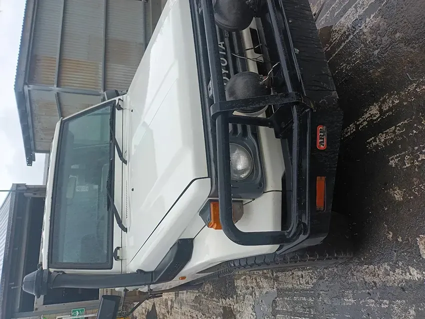 A White Truck With a Black Bumper is Parked in a Parking Lot — South West 4WD Wreckers In Brisbane, QLD