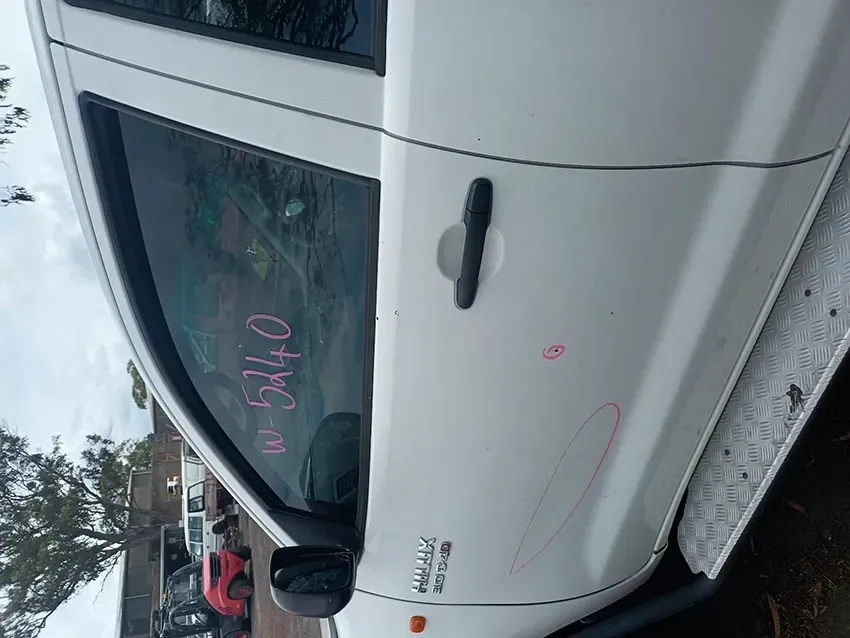 A White Truck is Parked on the Side of the Road — South West 4WD Wreckers In Brisbane, QLD