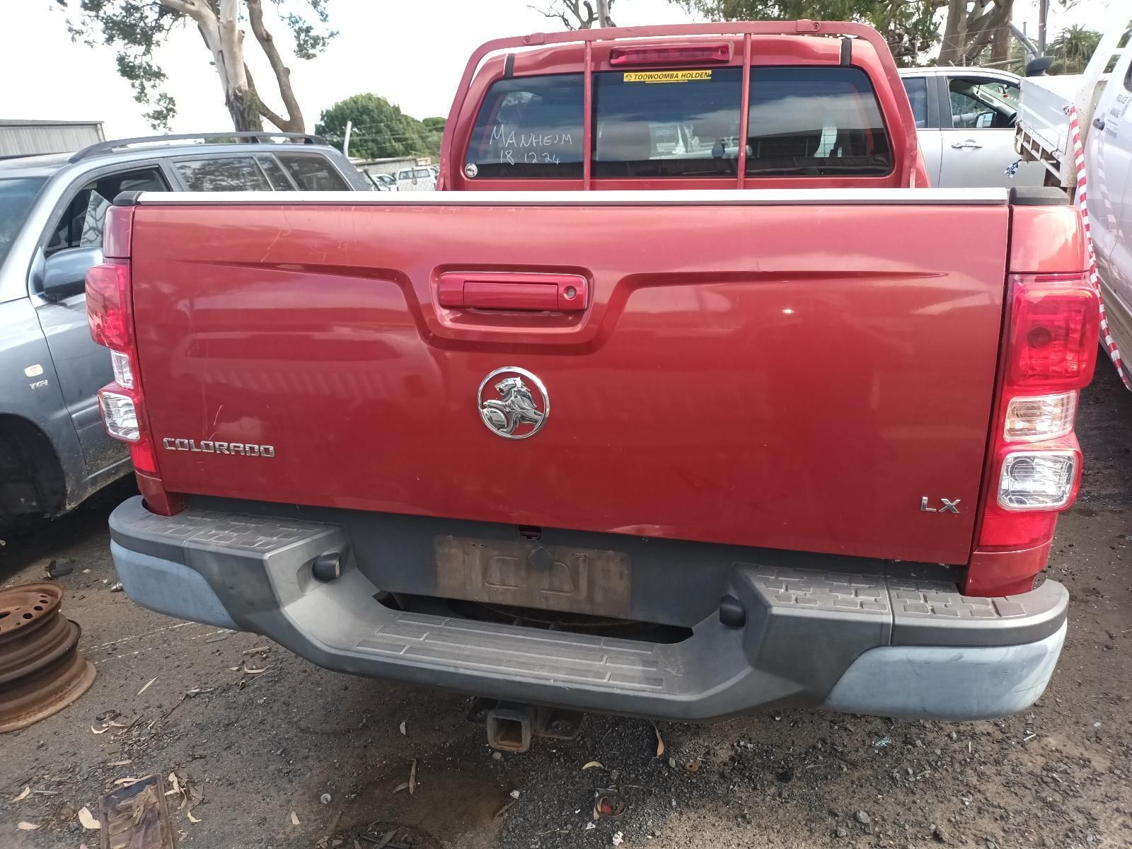 A Red Pickup Truck is Parked in a Parking Lot — South West 4WD Wreckers in Harristown, QLD