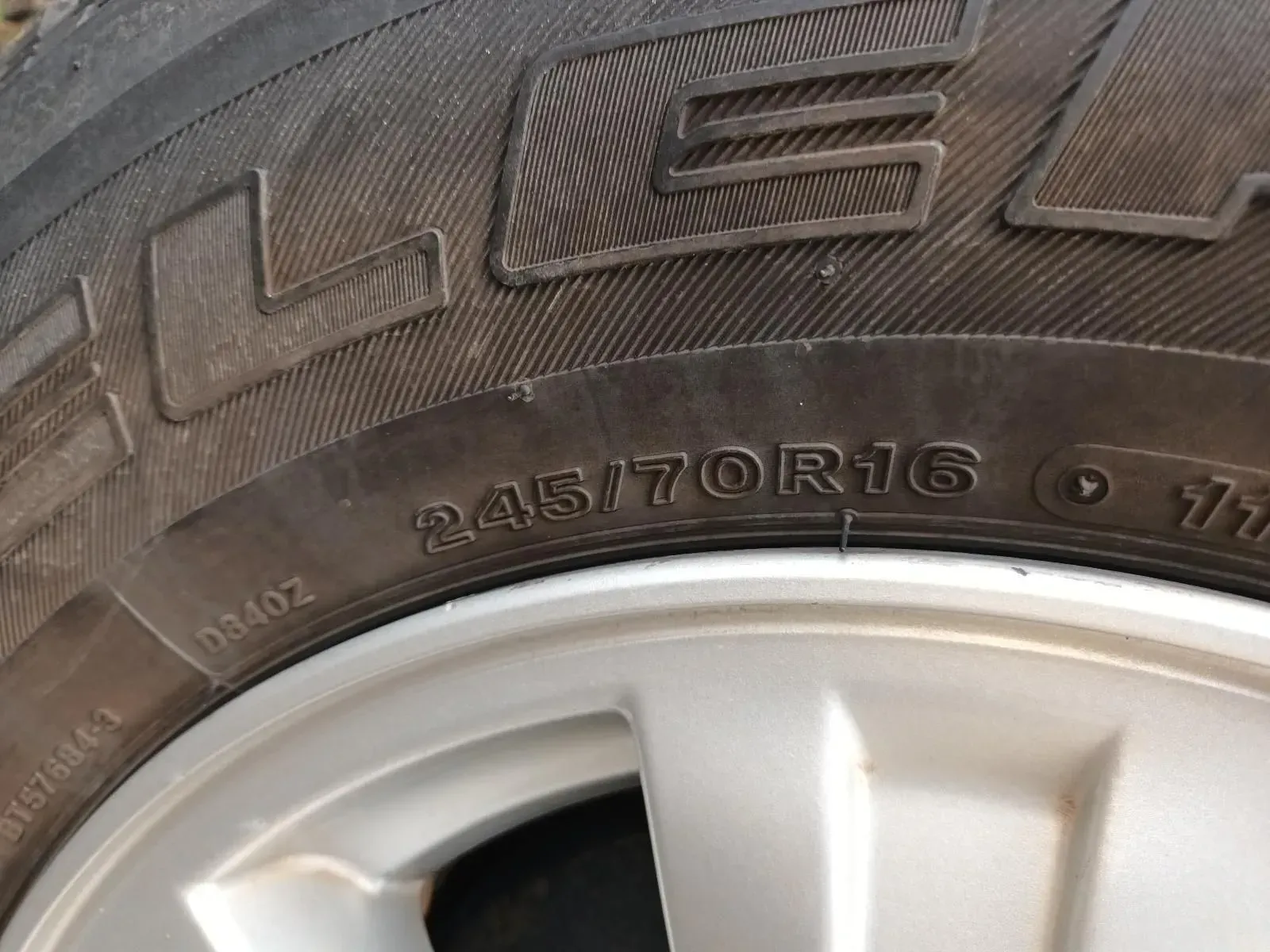 Close-up of a Car Tyre Showing Tyre Size 245/70r16 on a Silver Rim — South West 4WD Wreckers In Brisbane, QLD