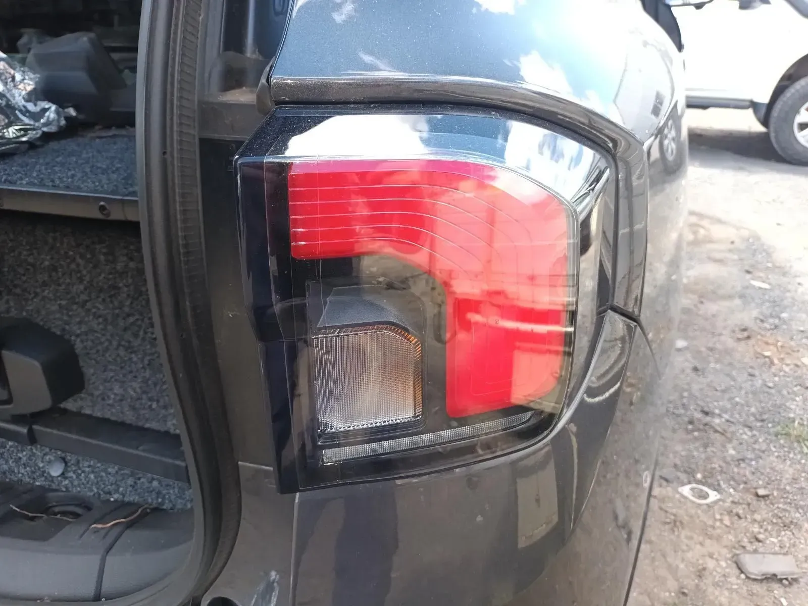 Dark Gray Vehicle's Tail Light, With Red Brake Light and Clear Turn Signal — South West 4WD Wreckers In Brisbane, QLD
