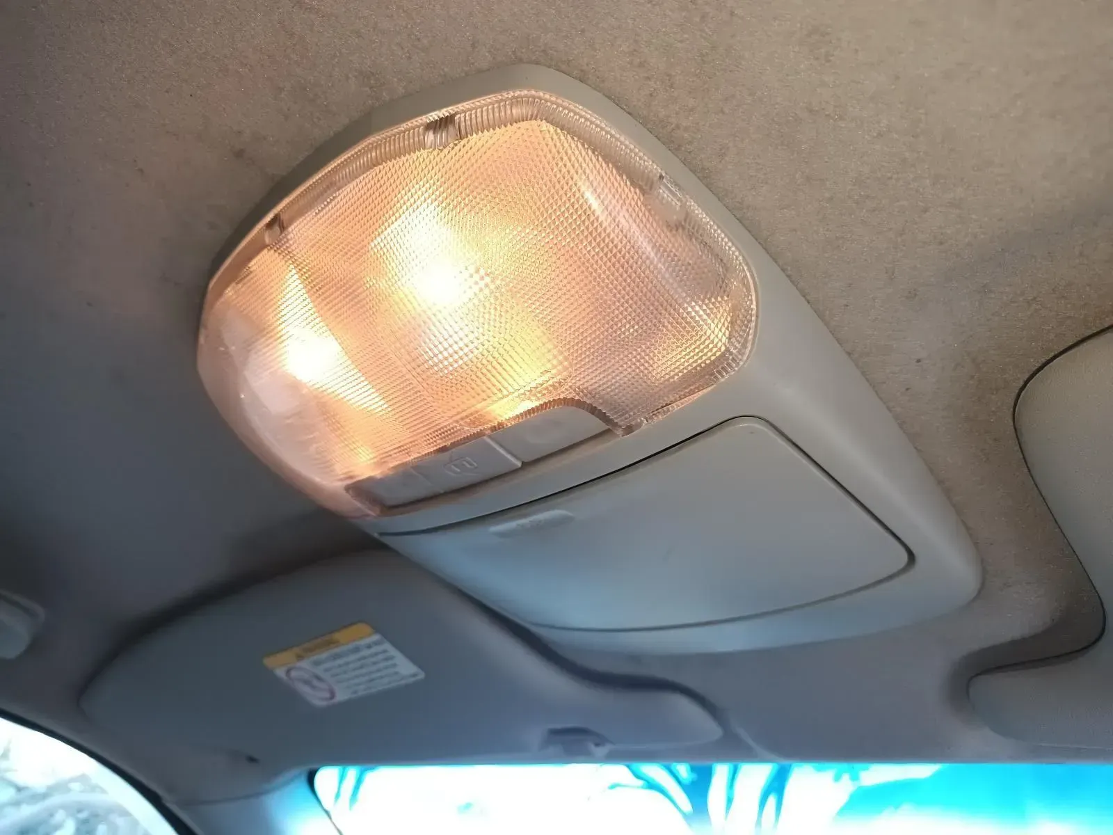Interior Car Ceiling Light Illuminating, With a Small Storage Compartment Below — South West 4WD Wreckers In Brisbane, QLD