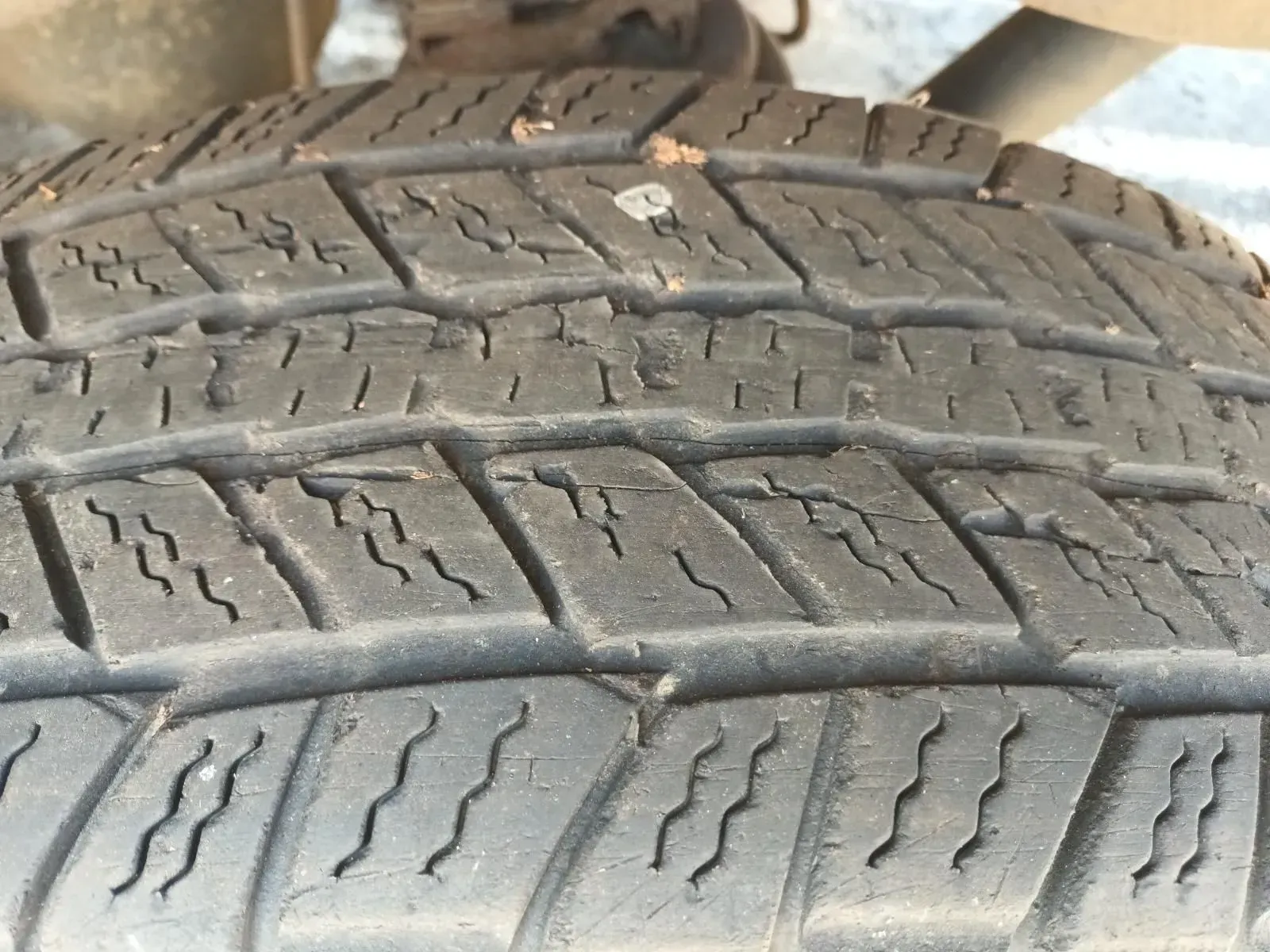 Close-up of a Worn Tyre Tread With Cracks and Debris — South West 4WD Wreckers In Brisbane, QLD
