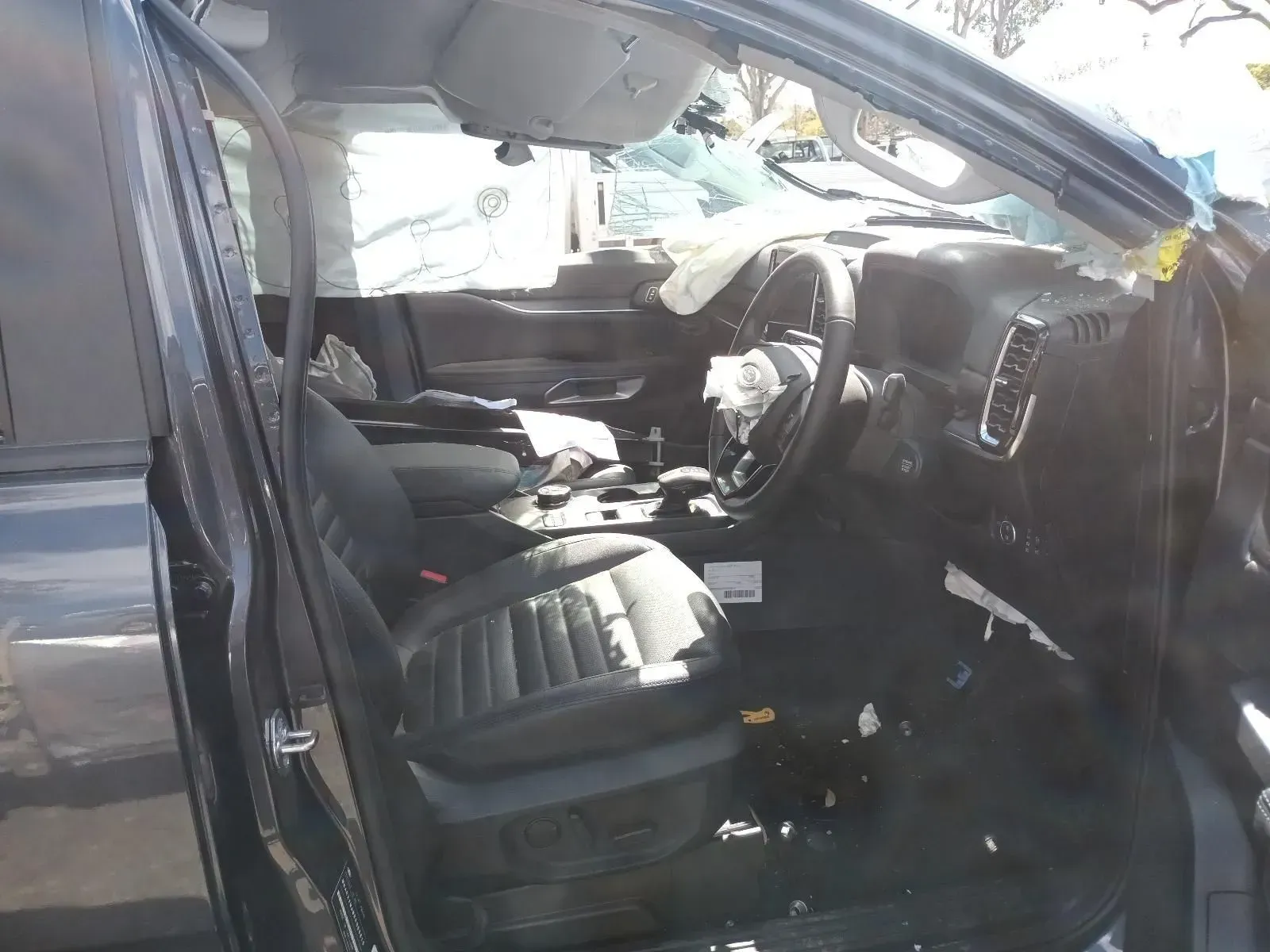 Interior of a Heavily Damaged Black Pickup Truck — South West 4WD Wreckers In Brisbane, QLD