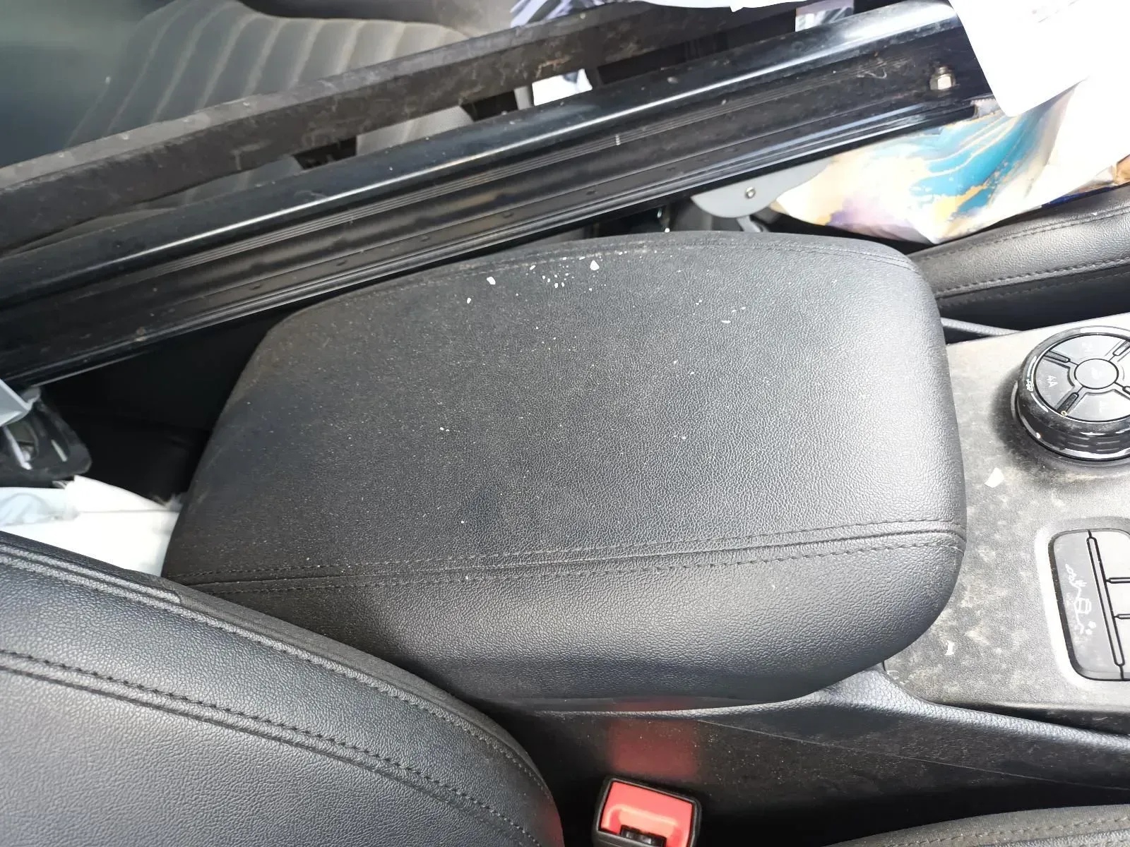 Black Car Armrest With a Textured Surface, Dust, and Debris — South West 4WD Wreckers In Brisbane, QLD