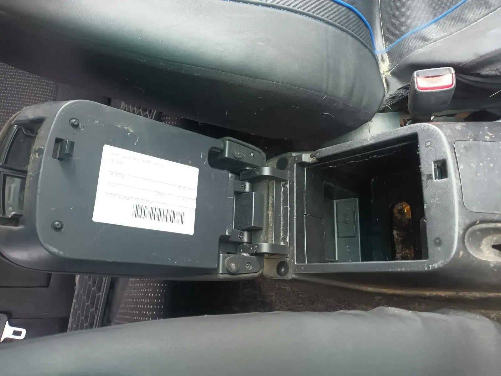 Open Car Center Console With a White Label, Near a Car Seat — South West 4WD Wreckers In Brisbane, QLD