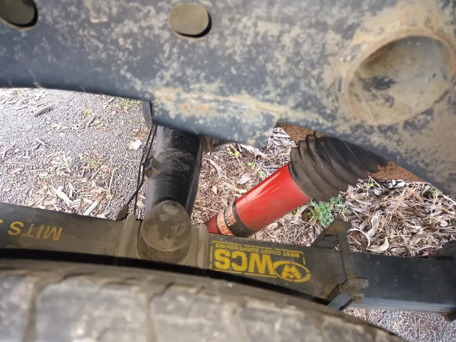 Red Shock Absorber on a Vehicle's Suspension System — South West 4WD Wreckers In Brisbane, QLD