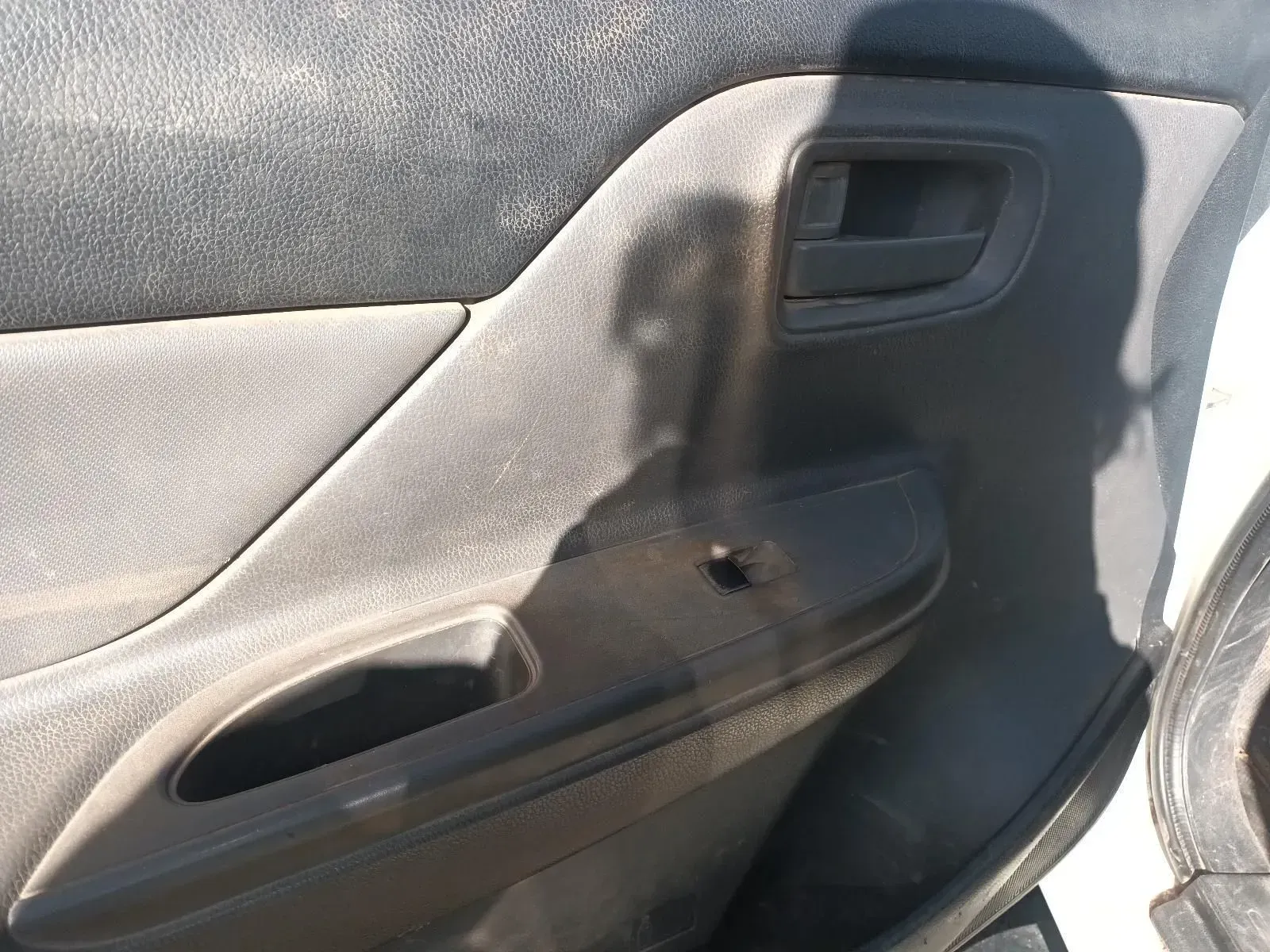 Dirty Gray Car Door Panel With a Hole — South West 4WD Wreckers In Brisbane, QLD