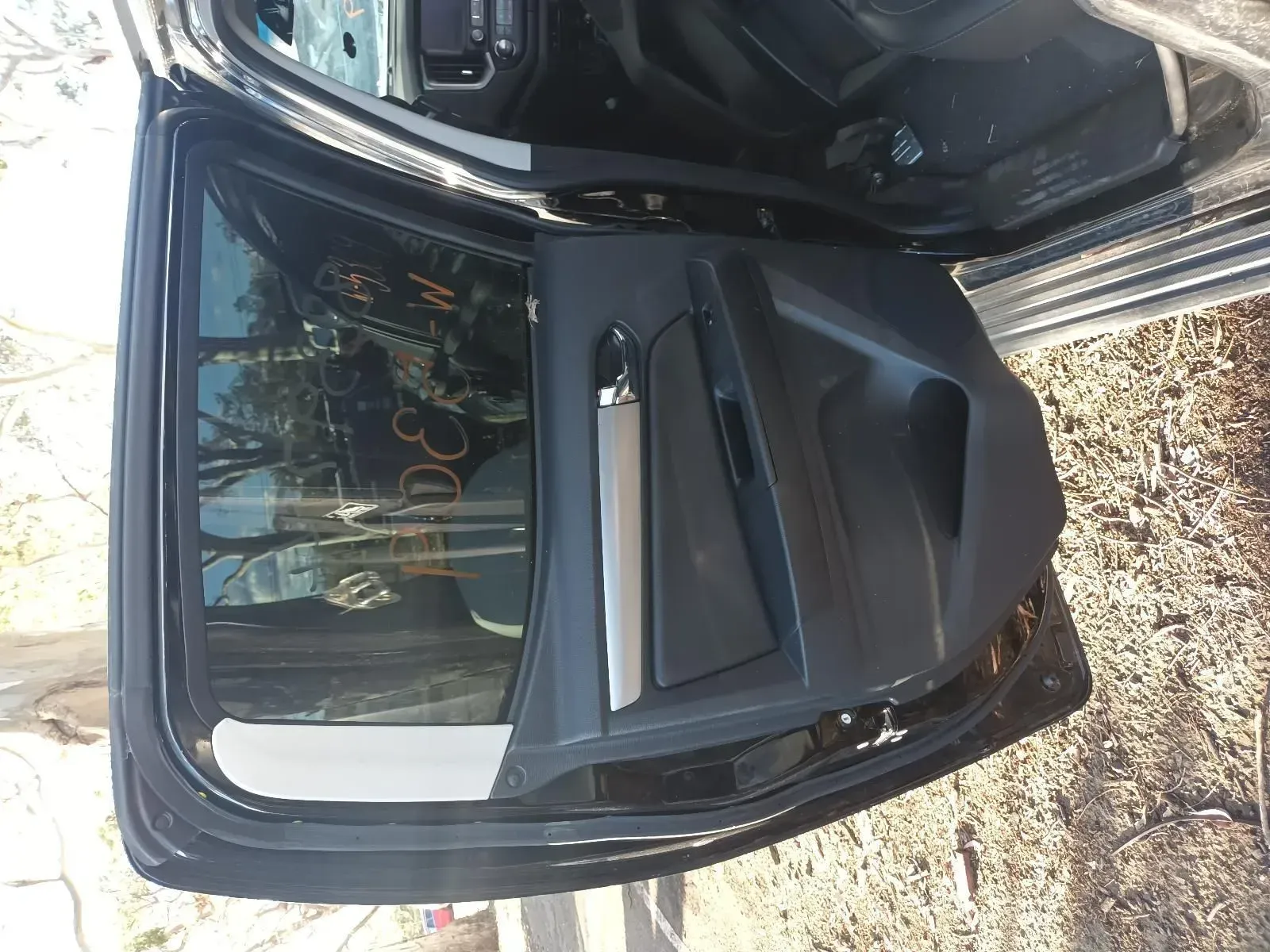 Black Car Door, Open, Interior Visible. Silver Handle and Black Trim — South West 4WD Wreckers In Brisbane, QLD
