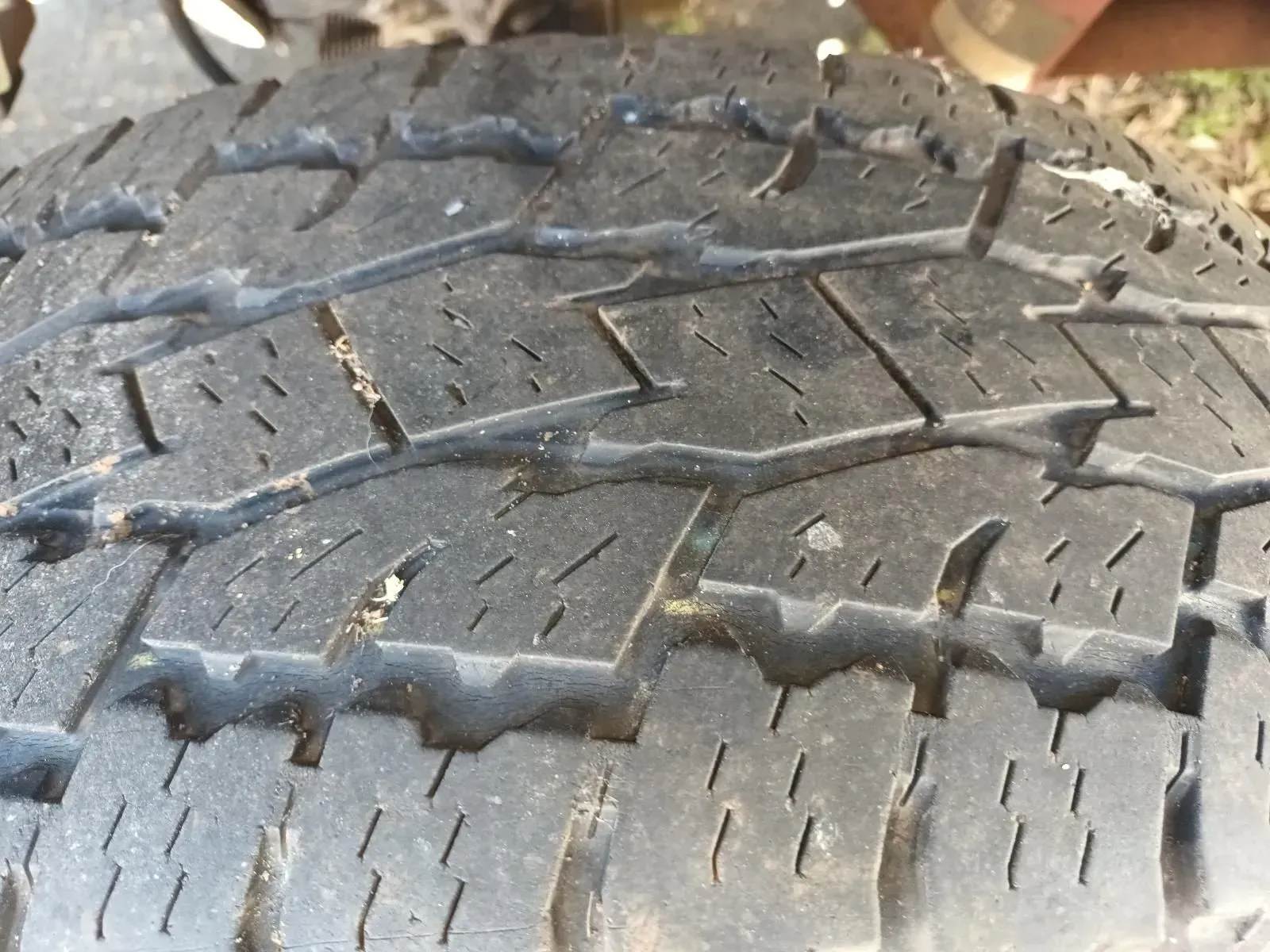 Close-up of a Worn Black Tyre With Visible Tread Pattern and Some Debris — South West 4WD Wreckers In Brisbane, QLD